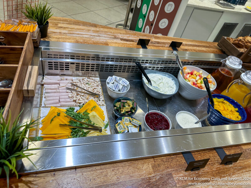 a buffet with different food items on a counter