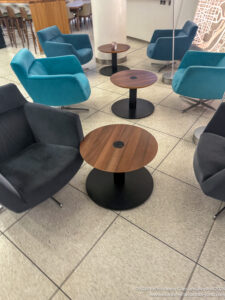 a group of chairs and tables in a room