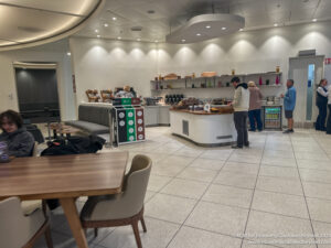 people in a room with a counter and a table