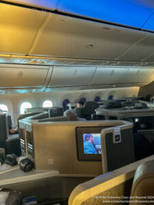 a group of people sitting in an airplane