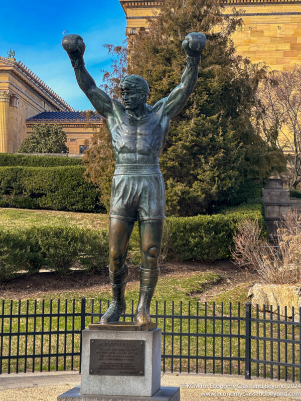 a statue of a man holding a ball