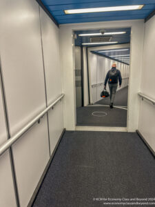 a man walking down a hallway