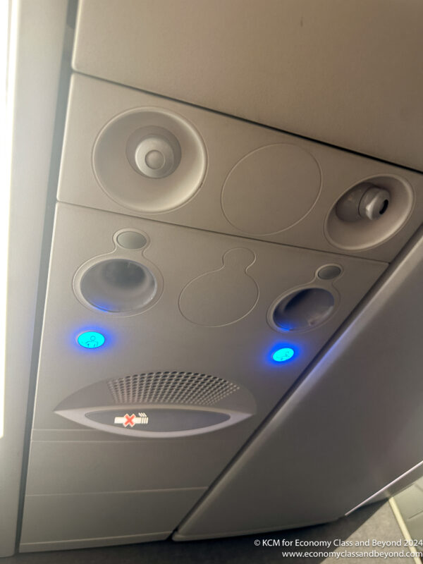 a ceiling with lights and speakers