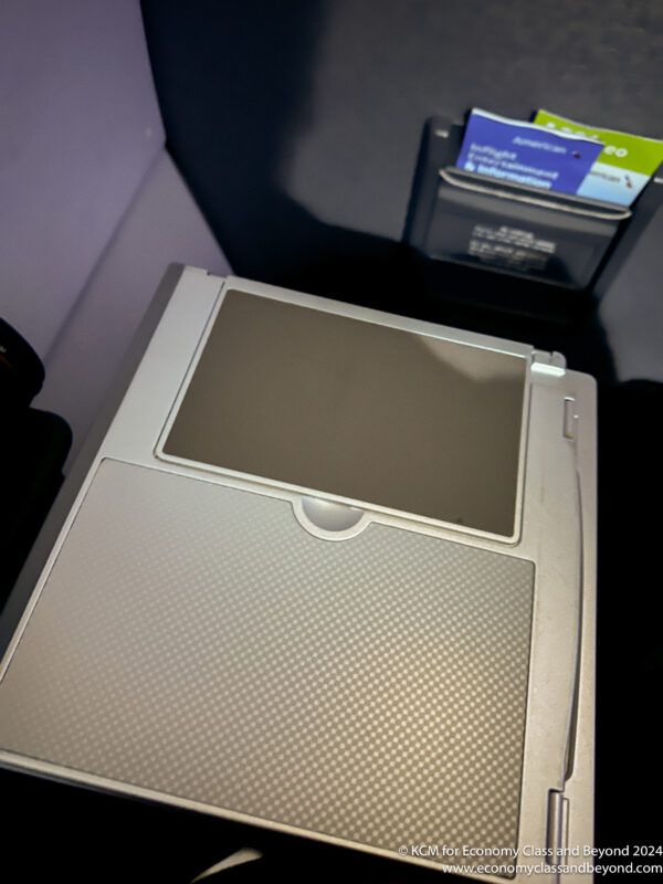 a grey rectangular object with a square screen