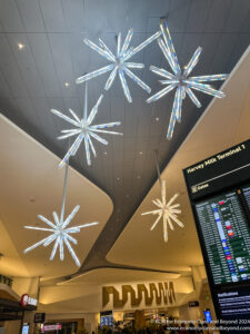 a ceiling with lights and a sign