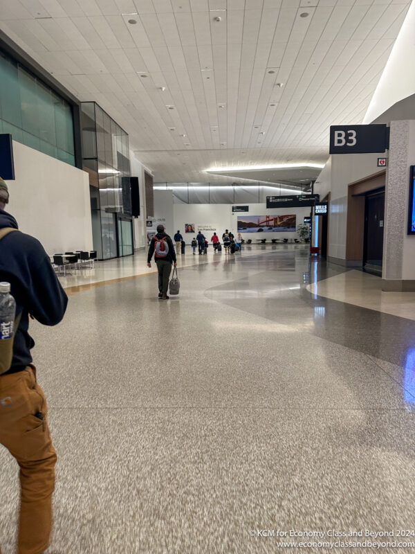people walking in a large airport