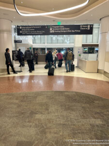 a group of people with luggage in a building