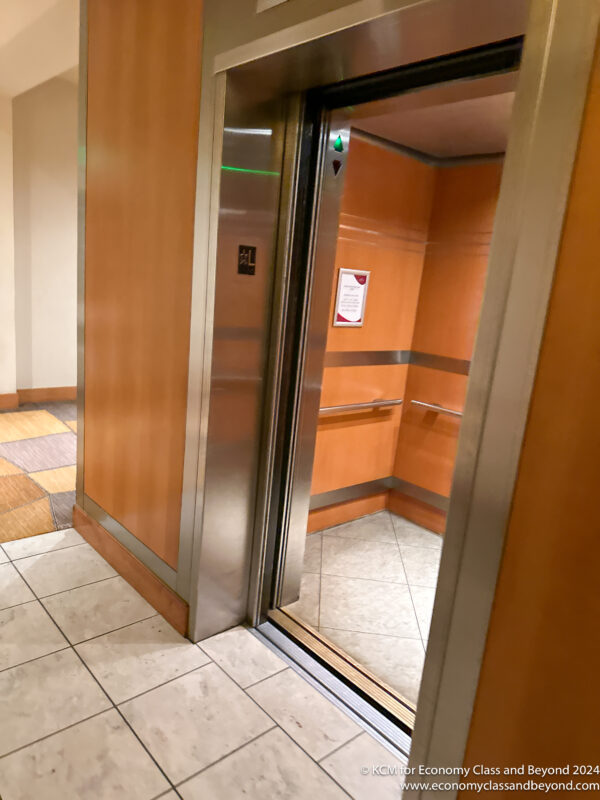 an elevator with a glass door