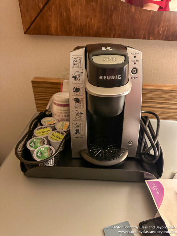 a coffee maker on a tray
