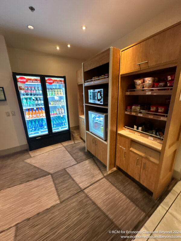 a room with shelves of food and drinks