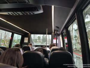 a group of people sitting in a bus