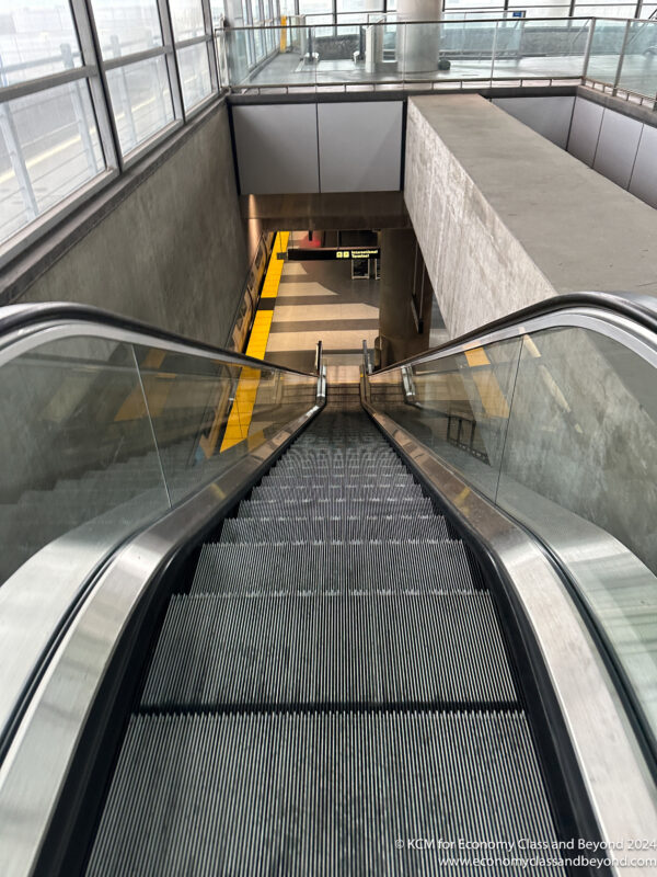 a escalator going up to a building