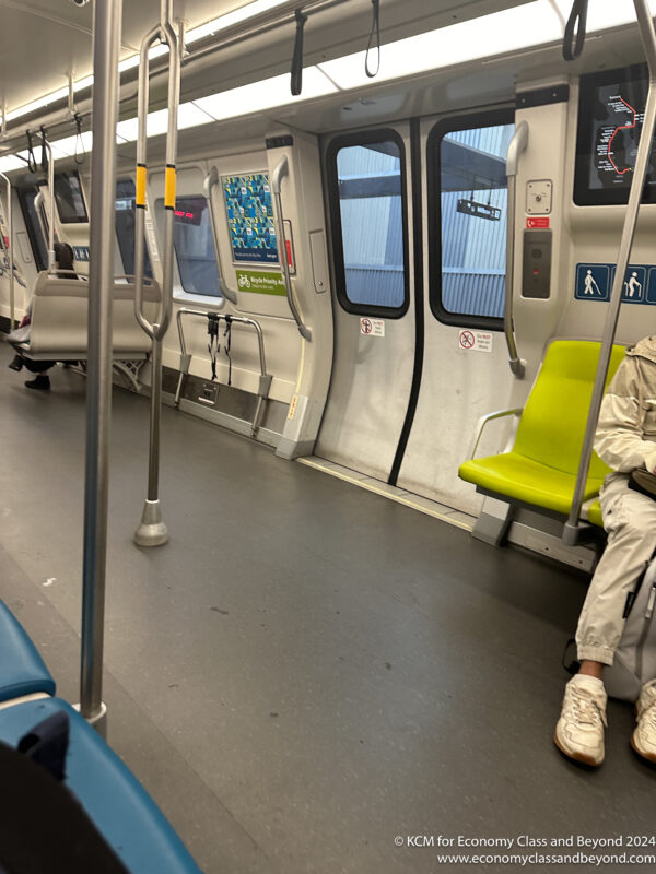 a person sitting on a subway car