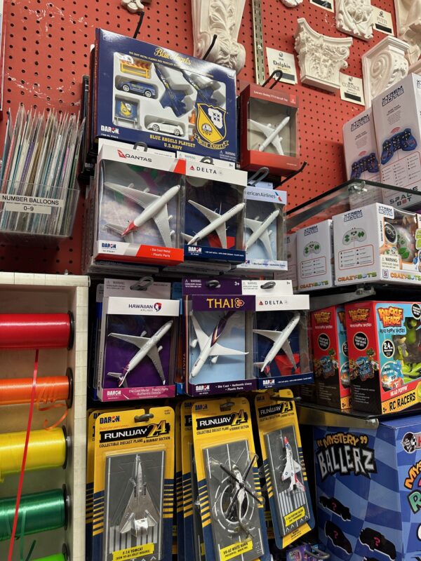 a group of toy airplanes in boxes