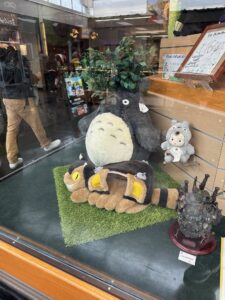 a group of stuffed animals in a window display