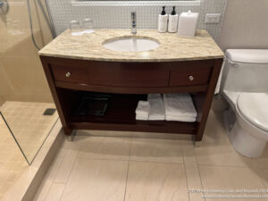 a bathroom sink with a marble counter top
