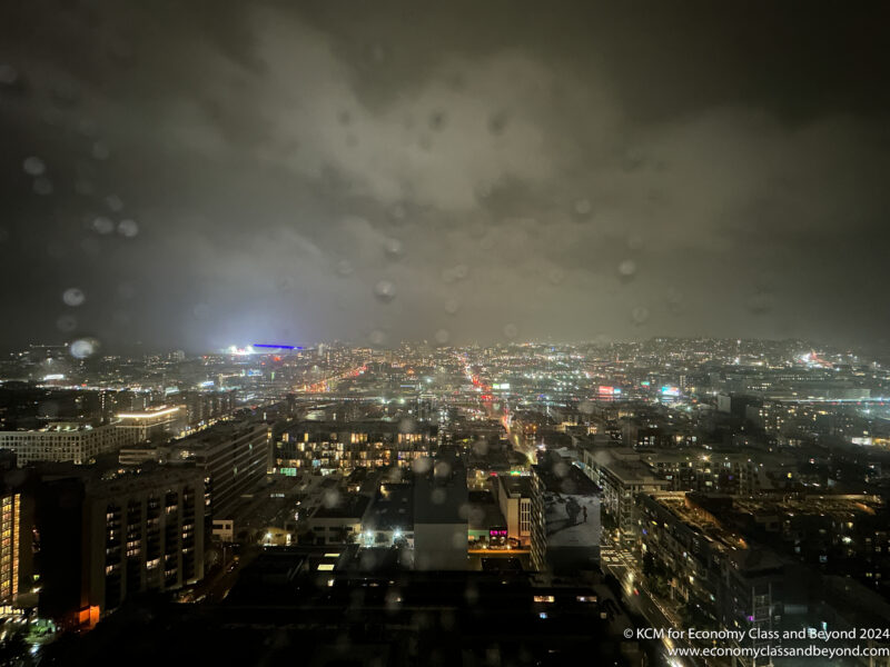 a city at night with rain drops