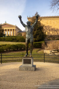 a statue of a man with a boxing ball in his hands