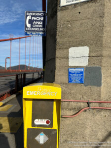 a yellow box on a concrete wall