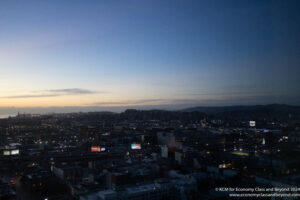 a city at night with a blue sky