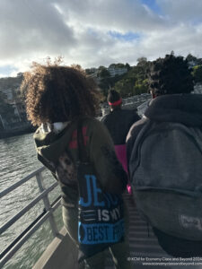 a group of people walking on a bridge