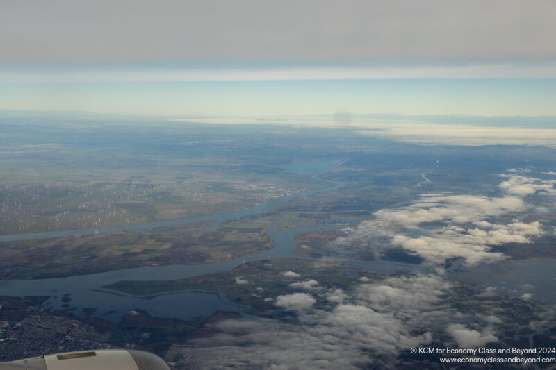 aerial view of a river and land from an airplane