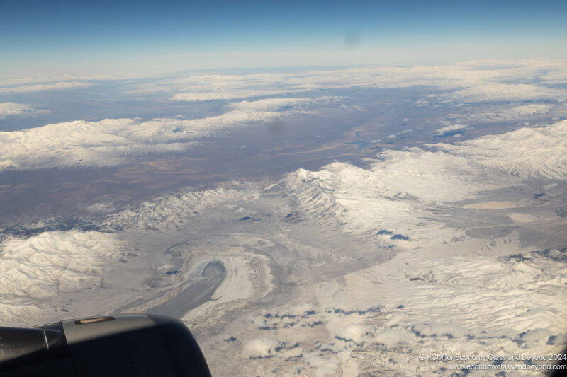 an aerial view of snow covered mountains