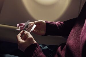 a person holding a small chocolate bar