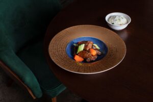 a plate of meat and vegetables on a table