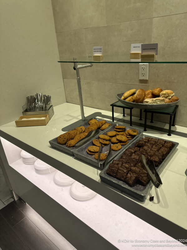 a trays of cookies and pastries on a counter