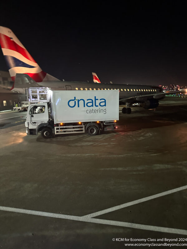 a truck parked on a tarmac at night