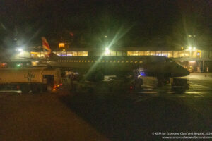 an airplane at night with lights on