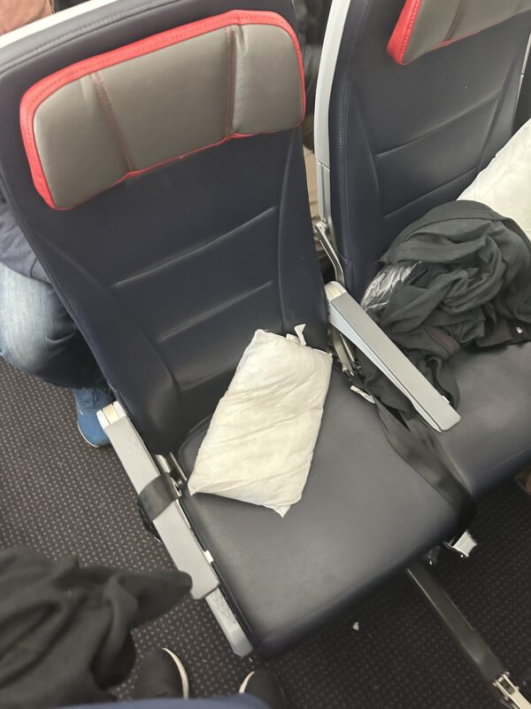 a seat with a white napkin on it