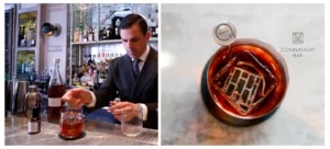 a man in a suit pouring a drink into a glass