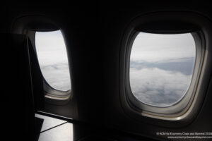 two windows with clouds in the sky