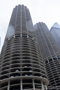 a tall buildings with round balconies