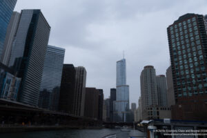 a city with tall buildings and a body of water