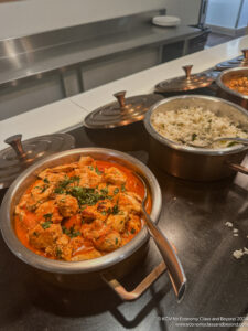 a group of pots with food in them