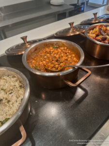 a group of pots with food in them