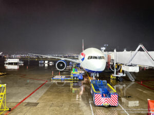 an airplane on the tarmac at night