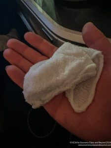 a hand holding a white towel