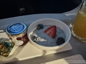 a bowl of oatmeal with fruit and jam