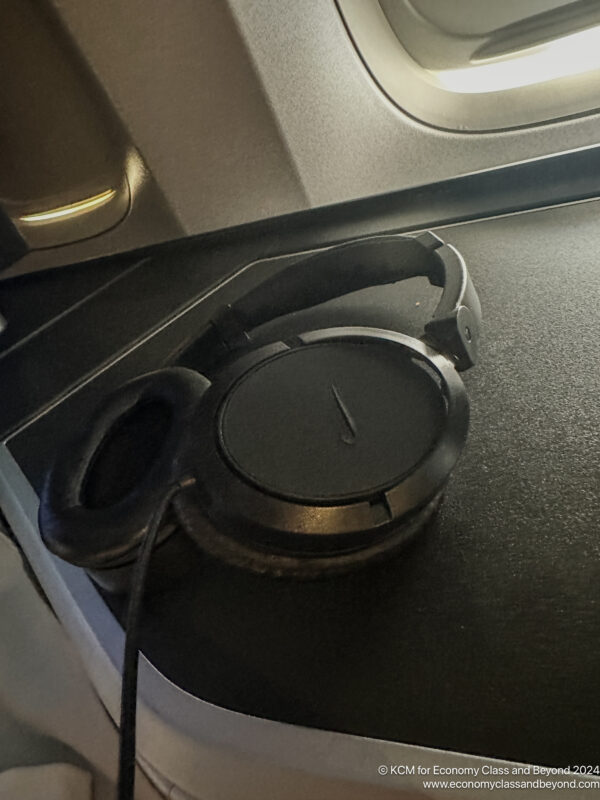 a black headphones on a black surface