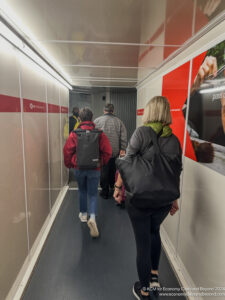 a group of people walking down a hallway