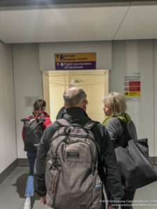 a group of people walking in an airport