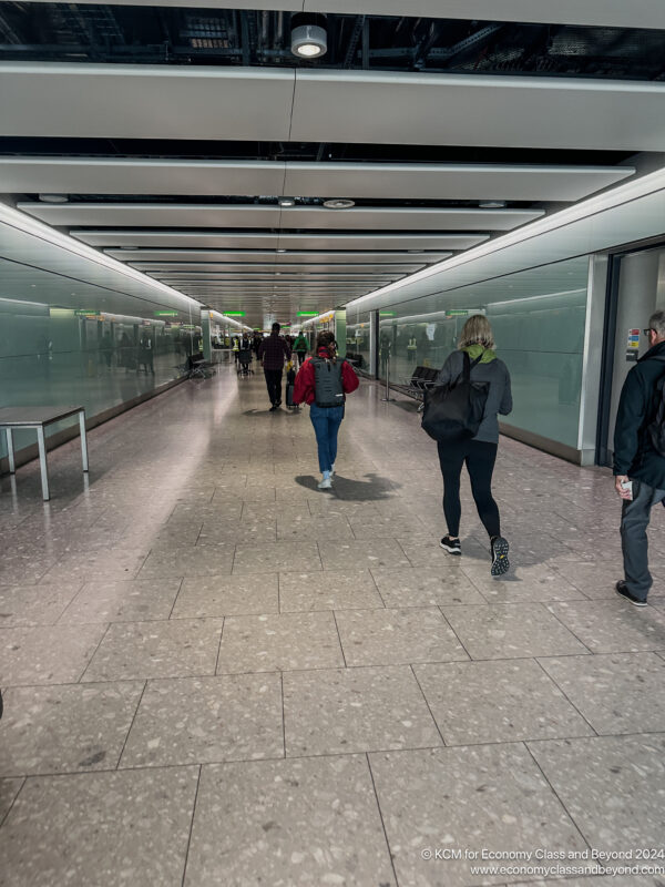 people walking in a hallway