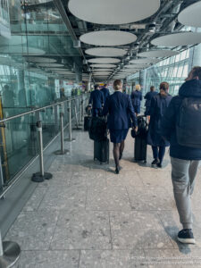 a group of people walking with luggage