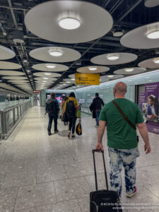 a group of people walking in a terminal