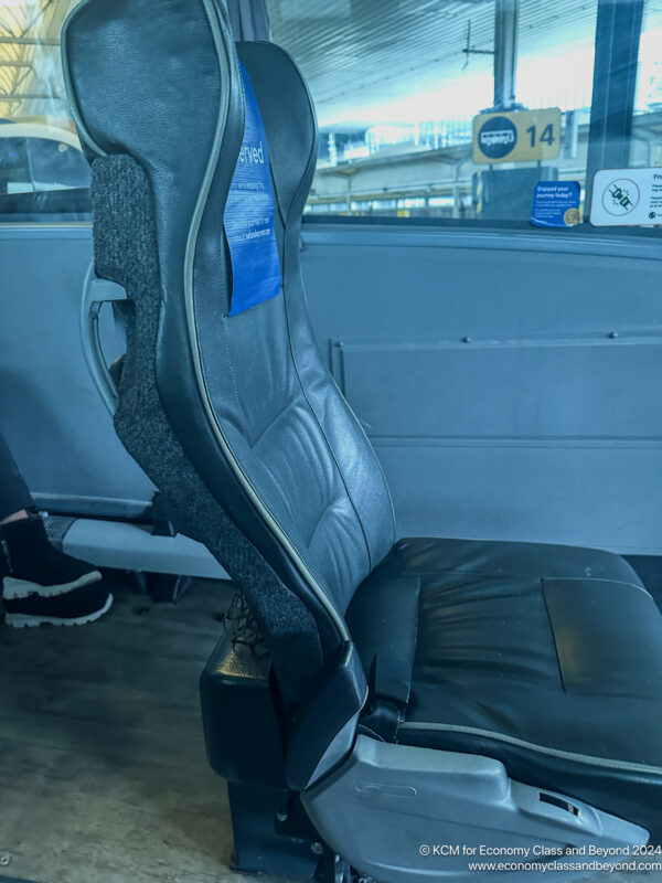 a black seat with a blue label on it