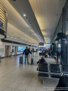 a man holding luggage in a terminal